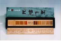 A ruler made of Moso bamboo and inlaid with 10 species of Taiwan's most important commercial woods.